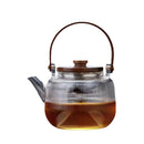 A high borosilicate teapot for brewing tea around a stove