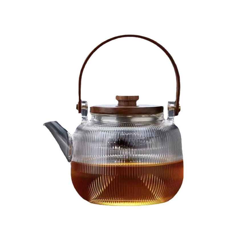 A high borosilicate teapot for brewing tea around a stove