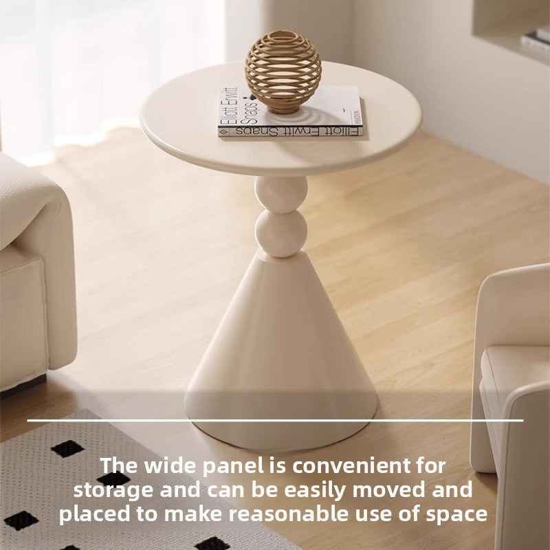 A small iron round table on the balcony