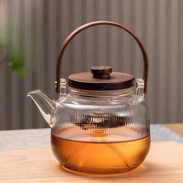 A high borosilicate teapot for brewing tea around a stove