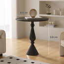 A small iron round table on the balcony