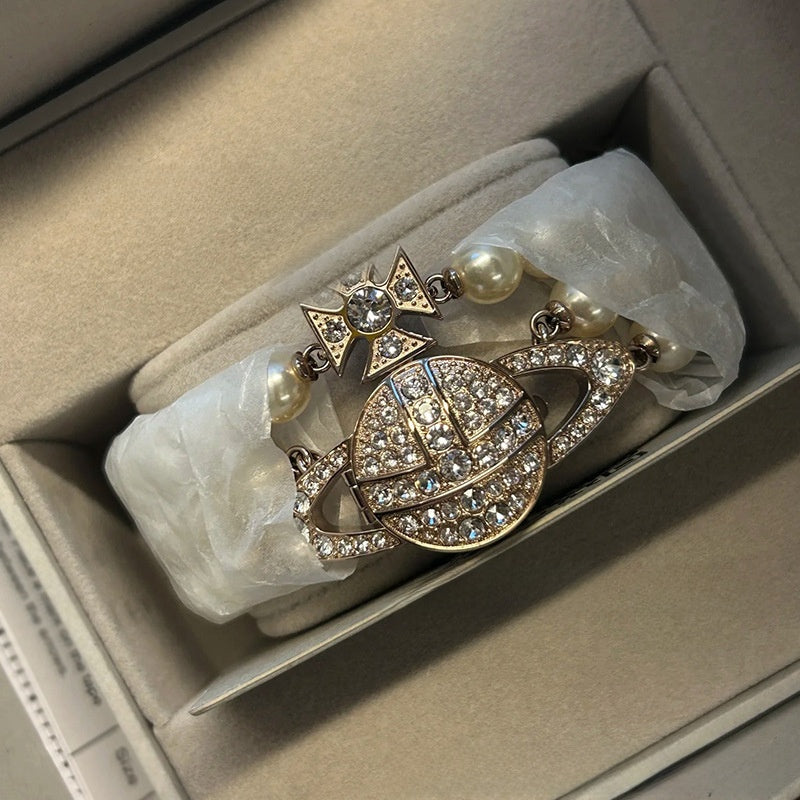 Pearl-set diamond style Saturn watch