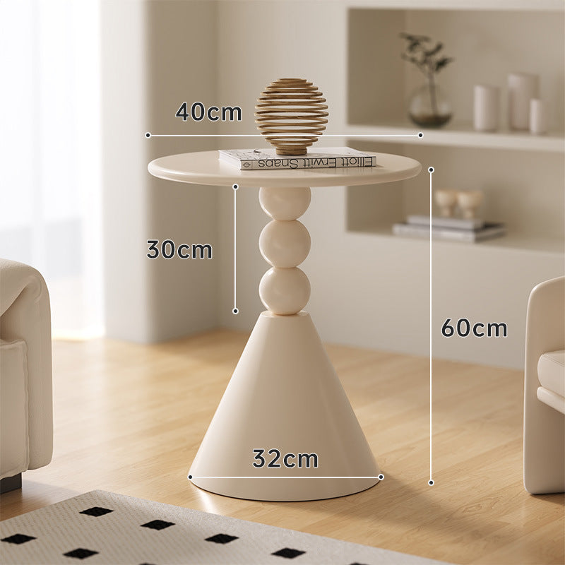 A small iron round table on the balcony