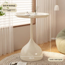 A small iron round table on the balcony