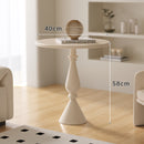 A small iron round table on the balcony