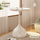 A small iron round table on the balcony