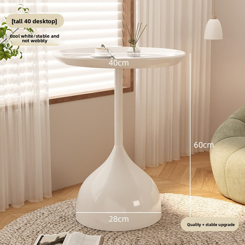 A small iron round table on the balcony