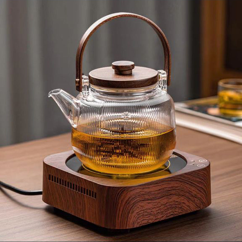 A high borosilicate teapot for brewing tea around a stove