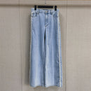 A light blue denim shirt and wide-leg pants suit