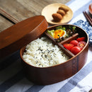 Oval-shaped coffee-colored wooden bento box