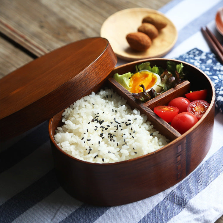 Oval-shaped coffee-colored wooden bento box