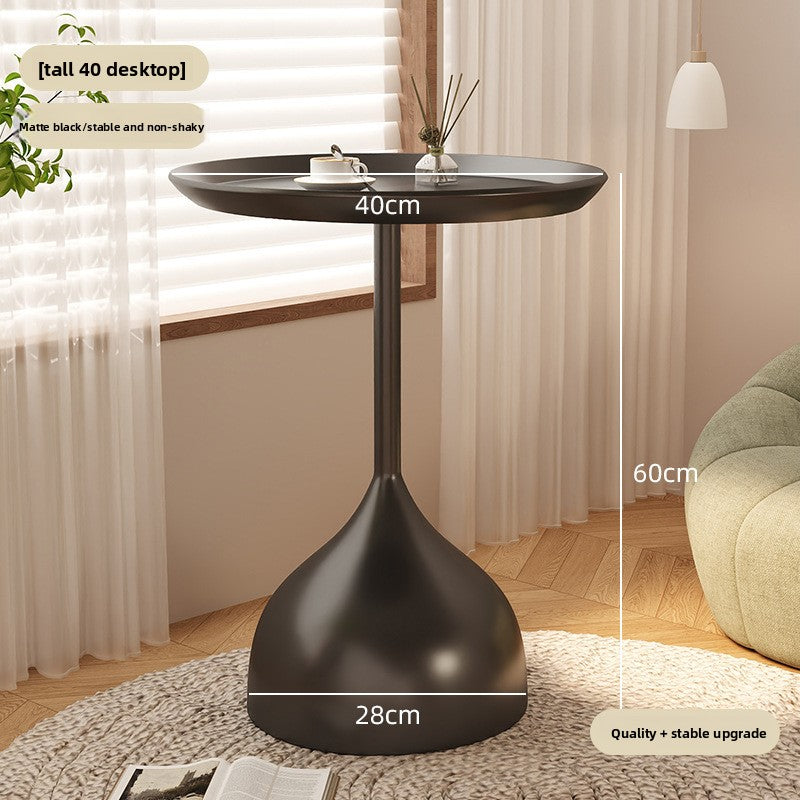 A small iron round table on the balcony