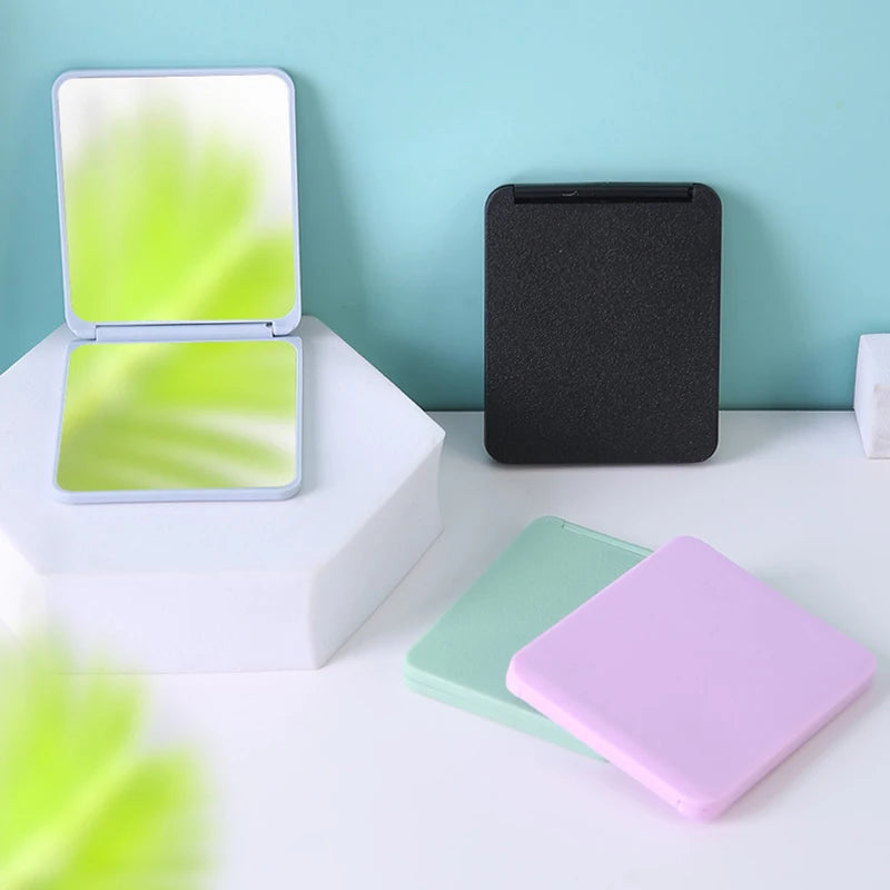 مرآة مكياج صغيرة محمولة قابلة للطي من البلاستيك مستطيلة الشكل للنساء، مرآة مكياج محمولة قابلة للطي، أدوات تجميل مدمجة