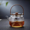 A high borosilicate teapot for brewing tea around a stove