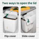 Wall-mounted trash can in the bathroom