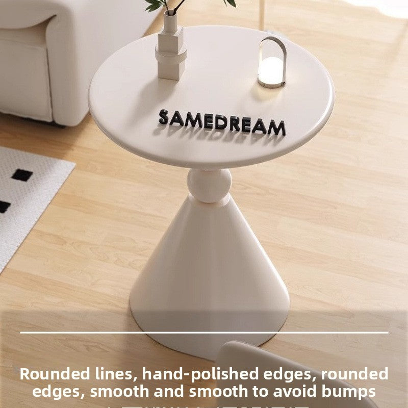 A small iron round table on the balcony