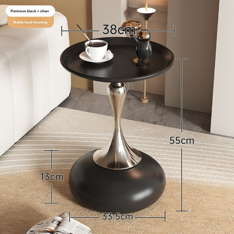 A small iron round table on the balcony