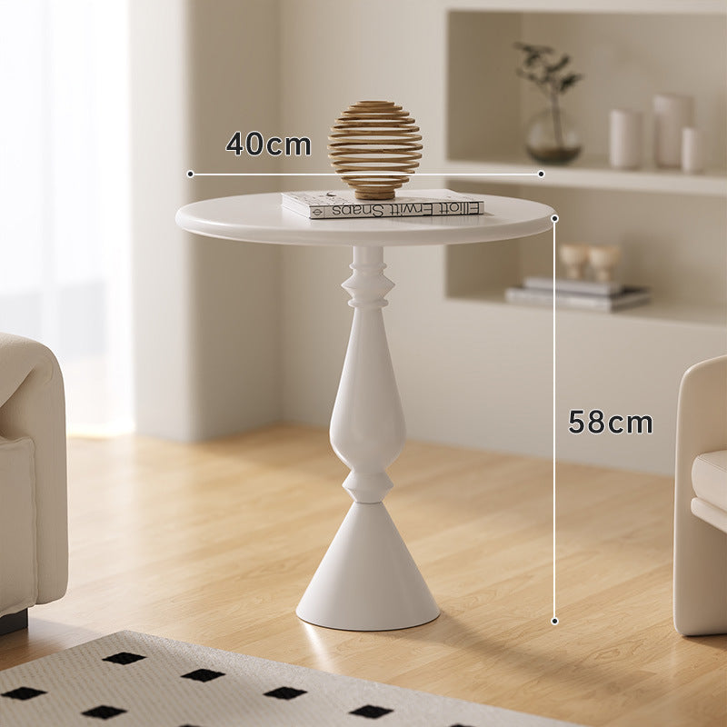 A small iron round table on the balcony