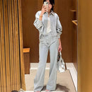 A light blue denim shirt and wide-leg pants suit